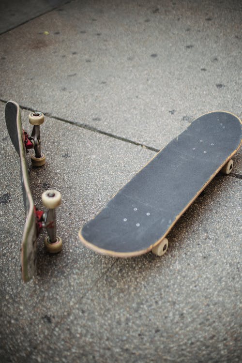 Skateboards placed on street paved road
