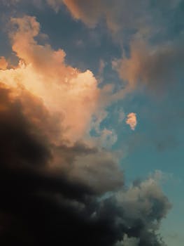 Colorful sunset sky with dramatic clouds creating a moody atmosphere.