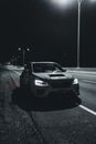Car with bright headlights driving on highway