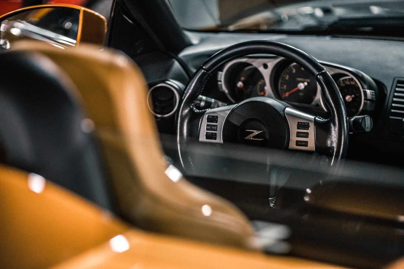 Luxury sport car interior dashboard with gauges and chrome accents
