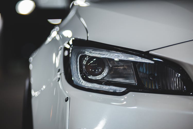 Shiny Surface Of New Car With Headlight