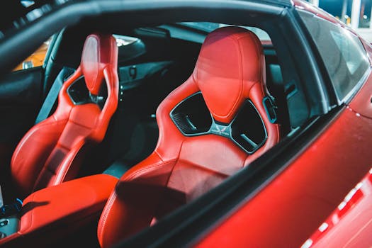 Luxurious red leather car seats in a modern sporty vehicle showcasing design and comfort.