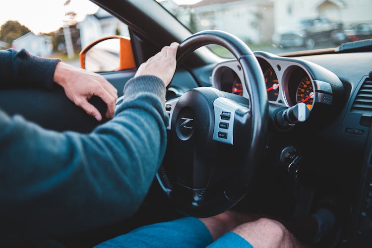 Man Driving Expensive Luxury Car In Comfortable Interior