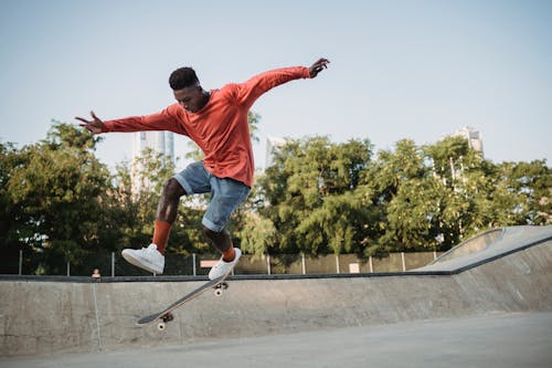 Free Man Jumping on a Skateboard Stock Photo