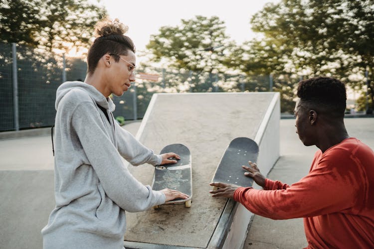 Young Diverse Friends Talking In Skate Park