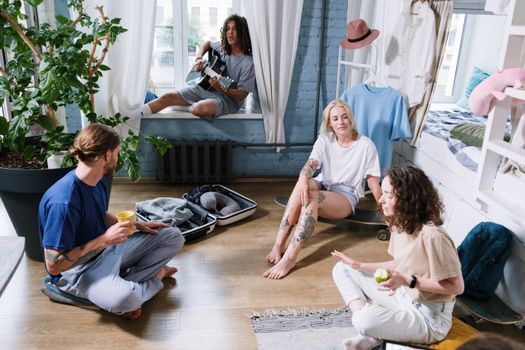 Woman in Gray T-shirt Sitting on Floor With Girl in White T-shirt