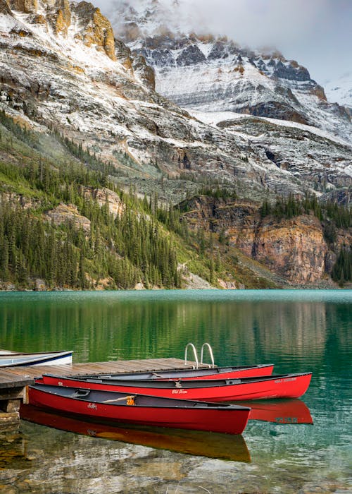 Red and Brown Boat on Lake