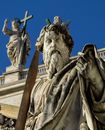 Man Holding Cross Statue