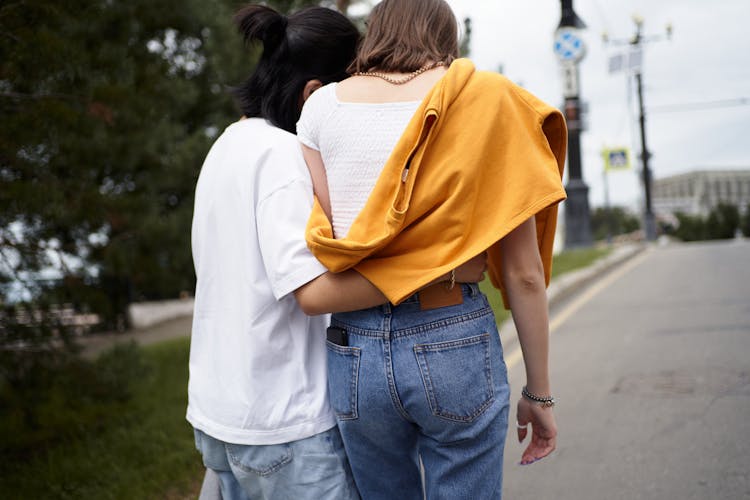 Two Girls Walking On The Street