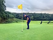 Man Wearing Blue Shirt Playing Golf
