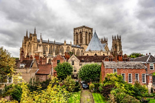 York Minster stands prominently against a cloudy sky in England, showcasing Gothic architecture.