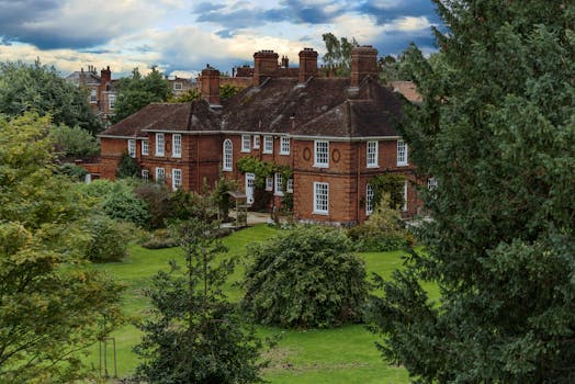 A beautiful brick mansion surrounded by lush greenery in York, England.