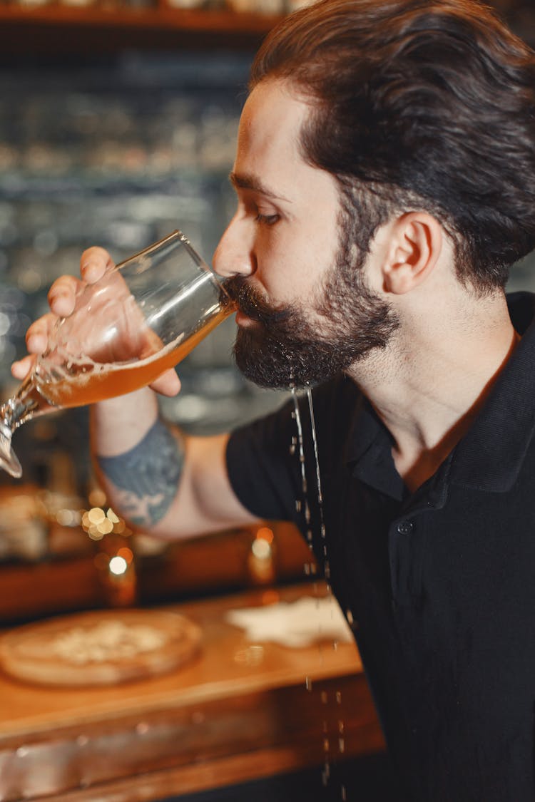 Man Drinking Beer Dripping From Beard