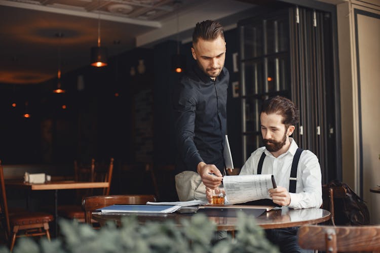 Men Looking At Menu