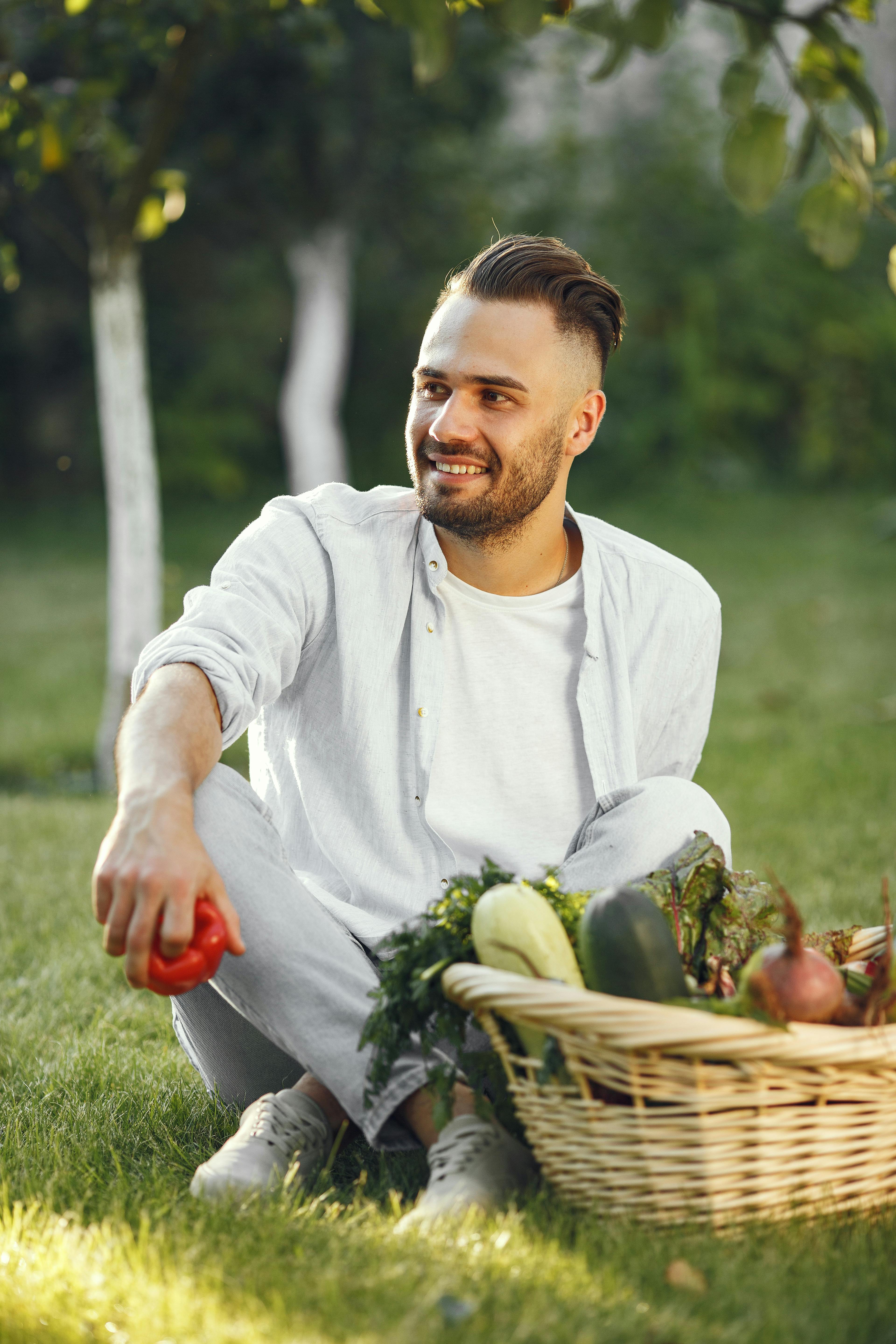 happy gardener with basket of homegrown vegetables