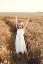Smiling Child in Dress in Hay Field