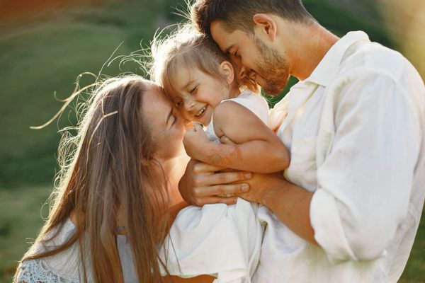 A parent embracing their child outdoors