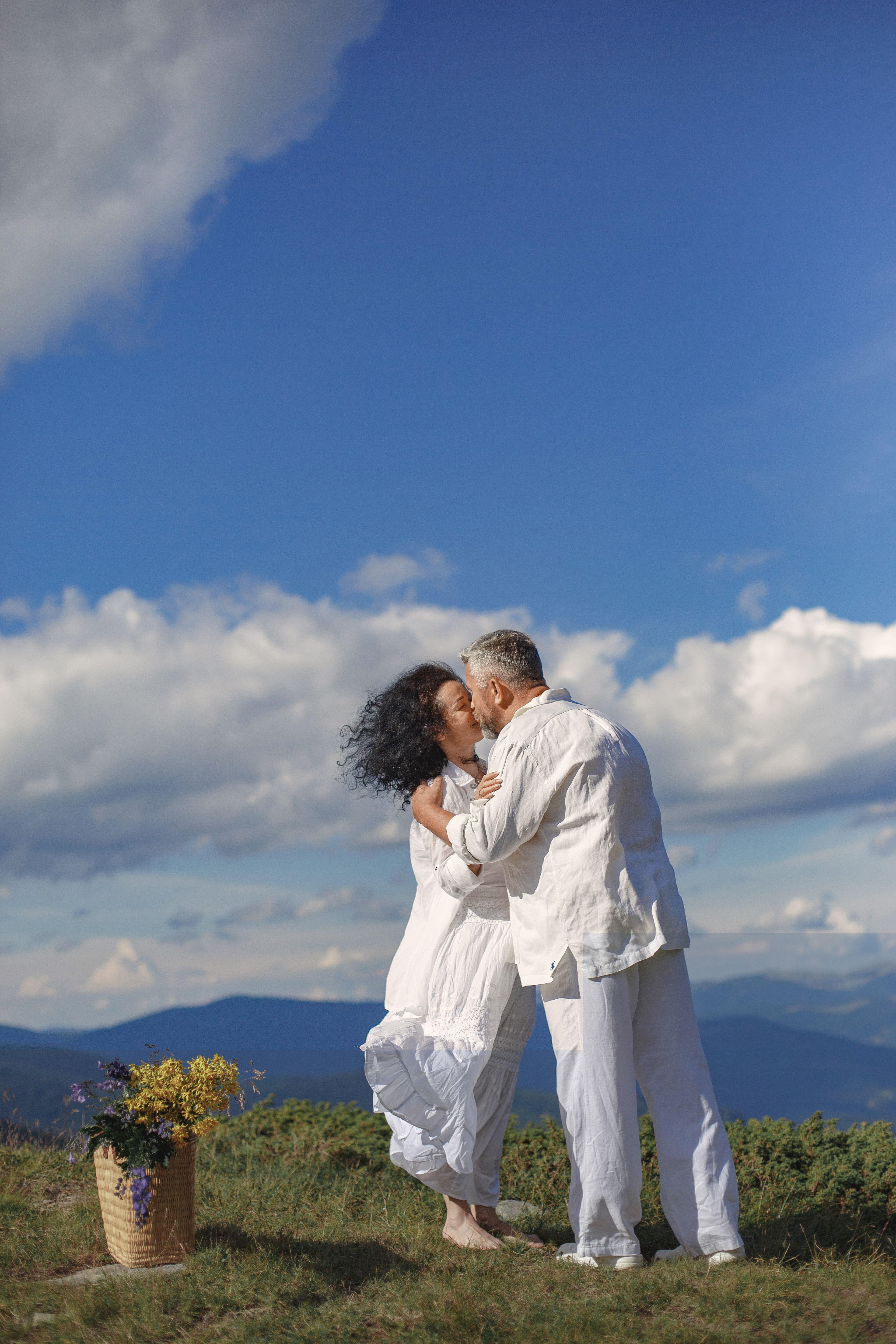 Man in White Dress Shirt Kissing Woman in White Dress Shirt on Green ...