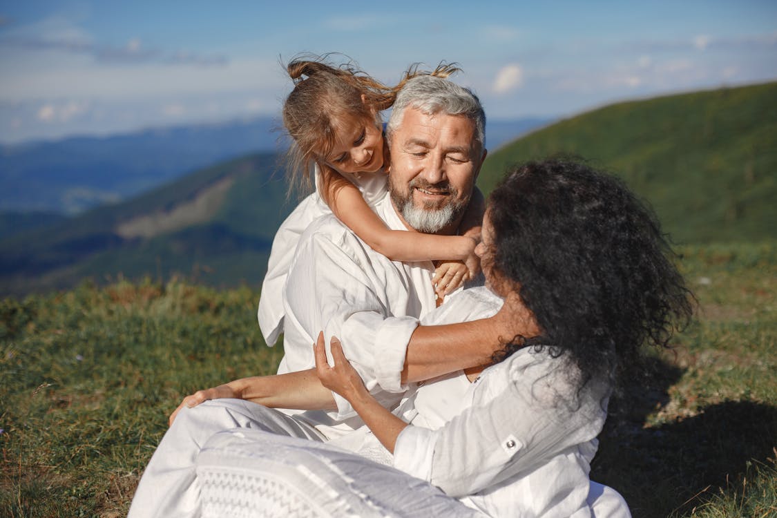 Free Grandparents Having Fun with Their Granddaughter Stock Photo