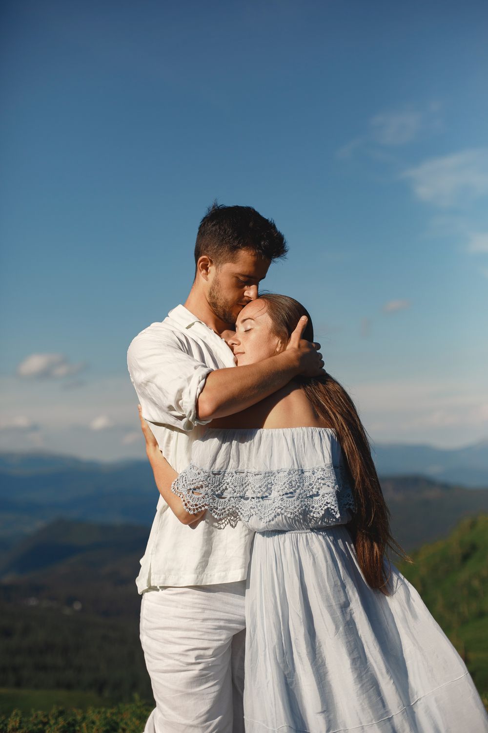 Man in White Dress Shirt Kissing Woman in Blue Dress · Free Stock Photo
