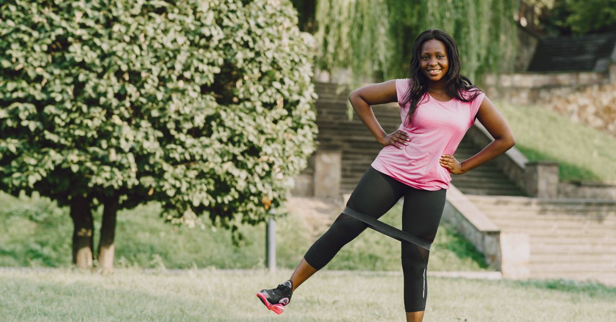 Woman over 40 training with resistance bands for strength