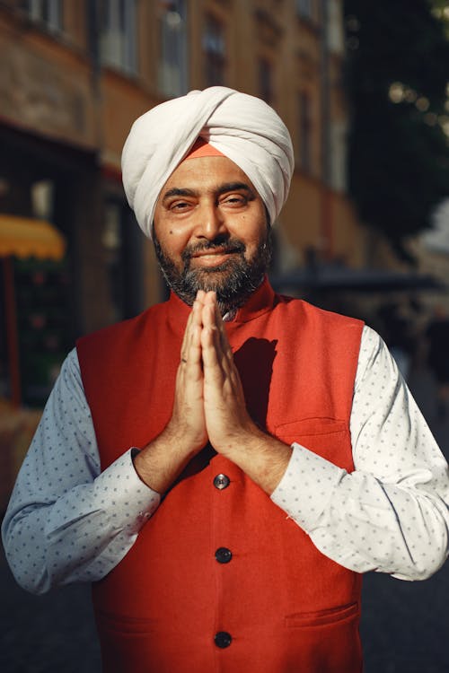 Man in White Long Sleeve Shirt Wearing White Turban