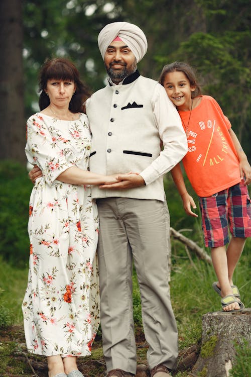 Couple Standing Beside their Child