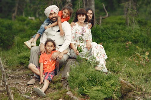 Family Sitting on a Tree Stump