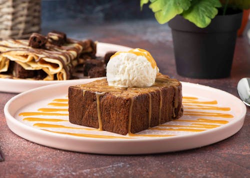 Brown and White Cake on White Ceramic Plate