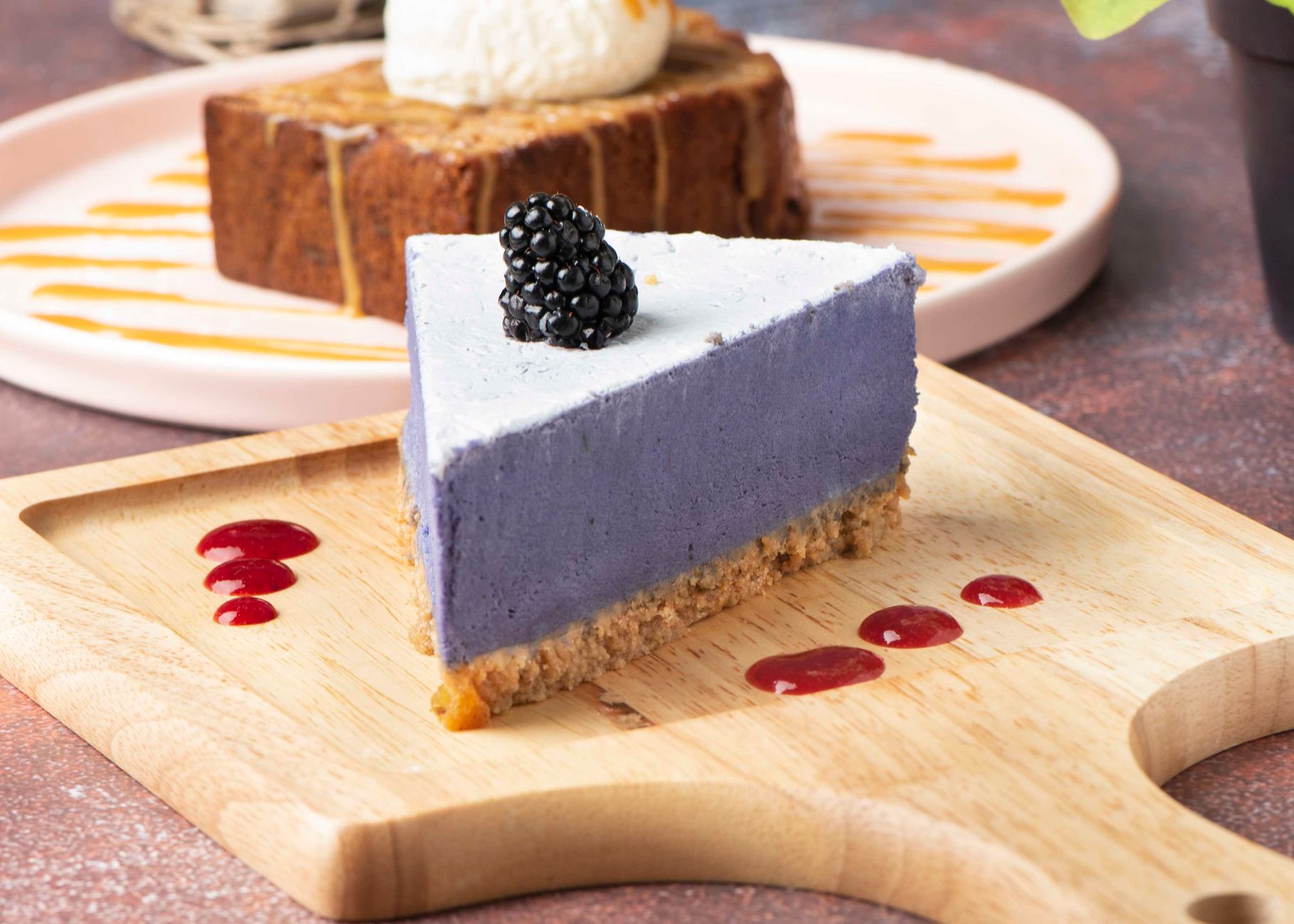Slice of blackberry swirl cheesecake
