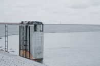 Metal construction located near barrier constructed to hold back water and raise level Konda Pochamma Sagar Reservoir