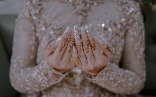 Free Woman's Hands Covered with Mehndi Stock Photo