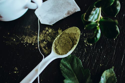 Free Green Powder on White Spoon Stock Photo