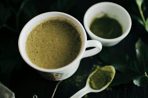 Close-Up Photo of Matcha Latte on a Ceramic Cup