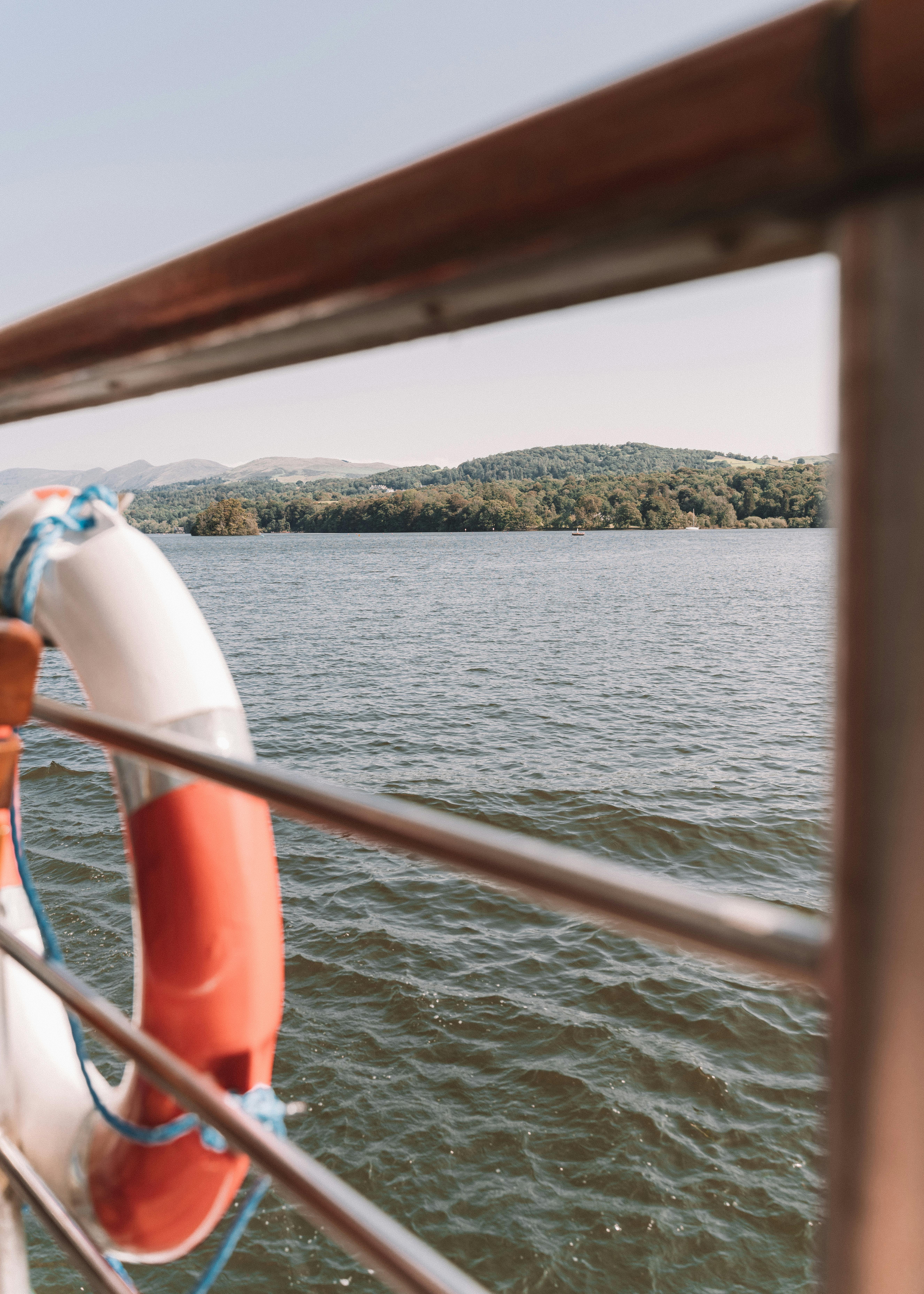 Boat deck railing with lifebuoy · Free Stock Photo