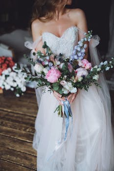 Captivating bridal bouquet held by a bride in a strapless gown. Perfect for wedding themes.