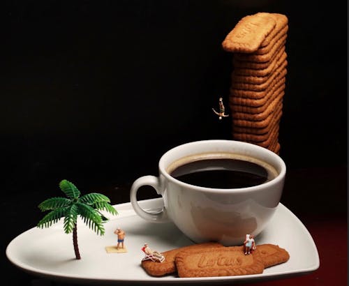 White Ceramic Mug With Coffee on White Ceramic Saucer