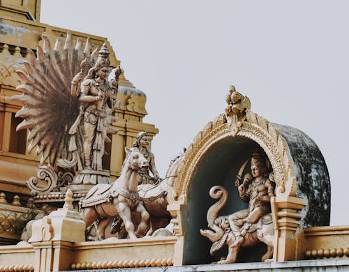Statues on Top of a Building