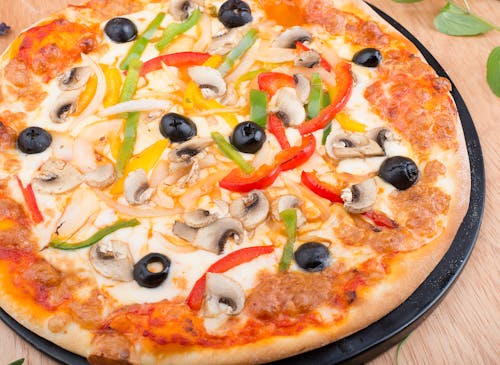 Pizza With Green and Red Bell Pepper on Top