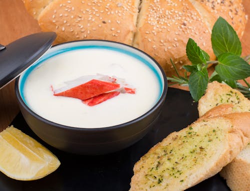 Free Soup in a Bowl with Bread on the Side Stock Photo