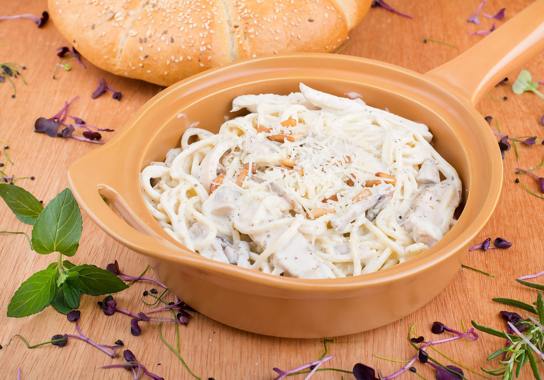Halal-certified Alfredo sauce jars on grocery shelf