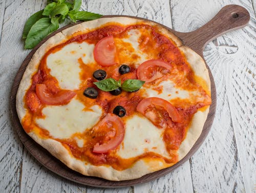 Free Pizza with Tomatoes and Cheese Stock Photo