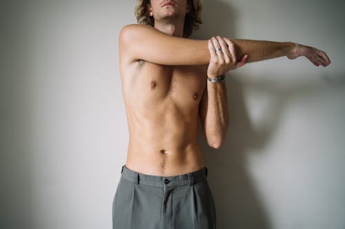 Free Topless Man in Gray Pants  Stock Photo