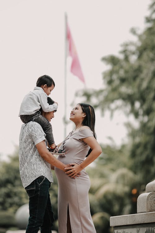 Man Holding Woman's Belly