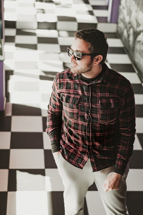 Free Man in Red and Black Plaid Dress Shirt and White Pants Standing  Stock Photo