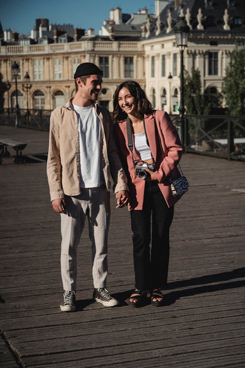 Free Man and Woman Holding Hands Stock Photo