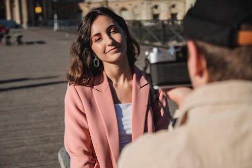 Woman in Pink Blazer Smiling for a Photo