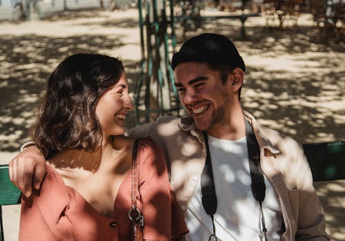 Man's Arm Around Woman's Shoulder