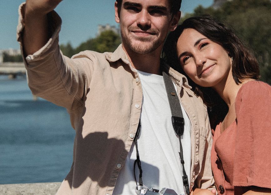 person looking at phone with dating app interface showing ghosting message