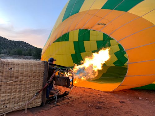 Free A Man Inflating a Hot Air Balloon Stock Photo